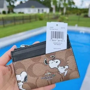 Coach X Peanuts Mini Skinny Id Case In Signature Canvas With Snoopy Print